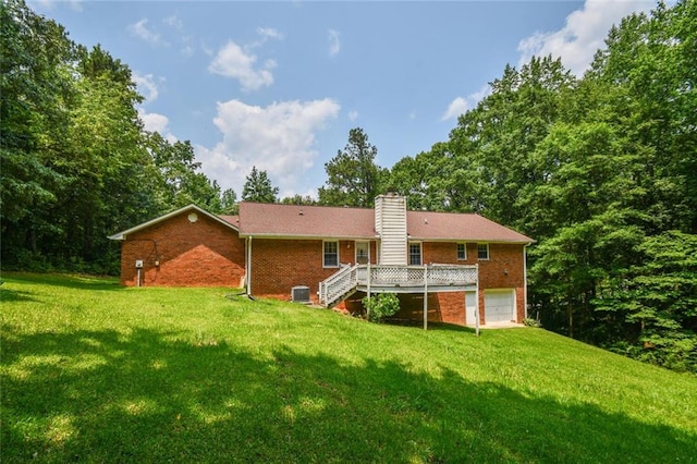 3223 Heritage Way, Buford, GA 30519 - back of house with brick siding, stairway, a garage, and a yard