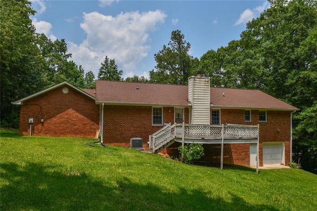 3223 Heritage Way, Buford, GA 30519 - rear view of property featuring brick siding, a deck, a garage, and a yard