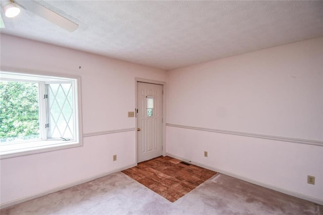 3223 Heritage Way, Buford, GA 30519 - foyer entrance with carpet flooring, baseboards, and a textured ceiling