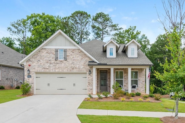 craftsman inspired home with a front yard and a garage