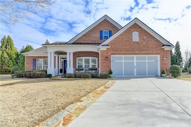 view of front facade with a porch, an attached garage, brick siding, concrete driveway, and a front lawn