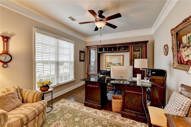 home office with ornamental molding, visible vents, and wood finished floors