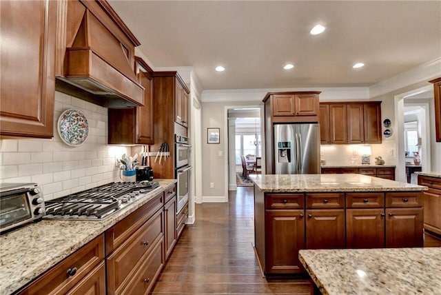 kitchen with appliances with stainless steel finishes, dark wood-style flooring, custom range hood, and light stone countertops