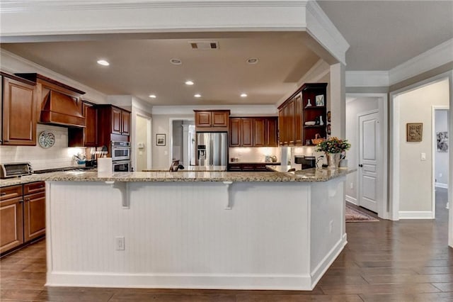 kitchen featuring stainless steel appliances, premium range hood, visible vents, open shelves, and dark wood finished floors