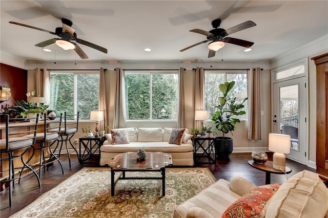 sunroom featuring a ceiling fan