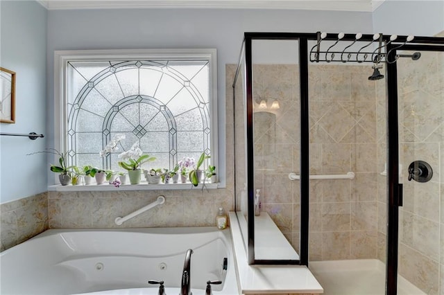 full bath featuring a stall shower and a tub with jets