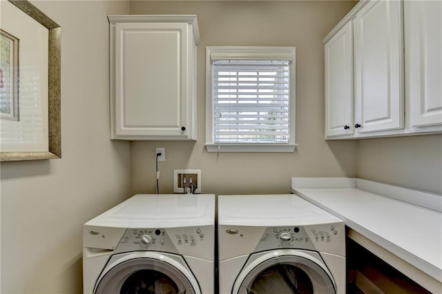 laundry room featuring cabinet space and washing machine and clothes dryer