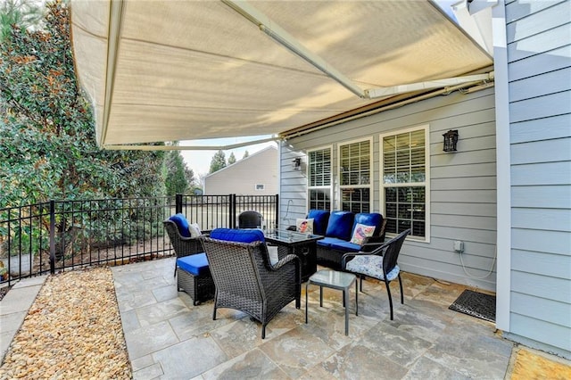 view of patio with fence and an outdoor living space