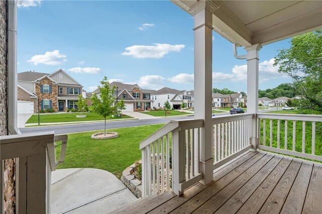 5545 Adirondack Dr, Cumming, GA 30040 - wooden porch featuring a residential view and a lawn