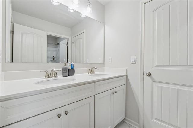 5545 Adirondack Dr, Cumming, GA 30040 - full bathroom with double vanity and baseboards