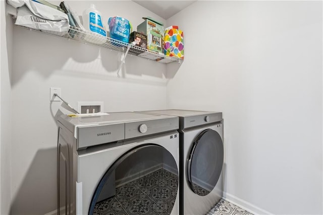 5545 Adirondack Dr, Cumming, GA 30040 - laundry room with washer and clothes dryer and baseboards