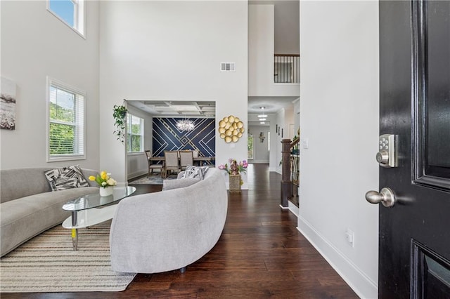 5545 Adirondack Dr, Cumming, GA 30040 - living room featuring a high ceiling, wood finished floors, and healthy amount of natural light