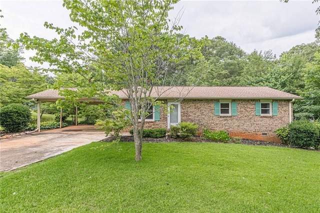 ranch-style house with a front yard and a carport