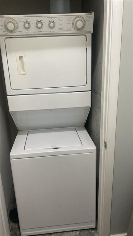 361 17th St NW Unit 1717, Atlanta, GA 30363 - washroom featuring stacked washer / dryer