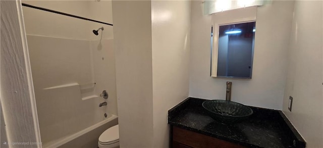 bathroom with vanity, toilet, and shower / bath combination