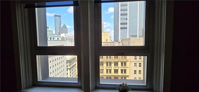 doorway to outside featuring healthy amount of natural light and a view of city