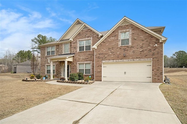 view of front of property featuring a garage and a front yard