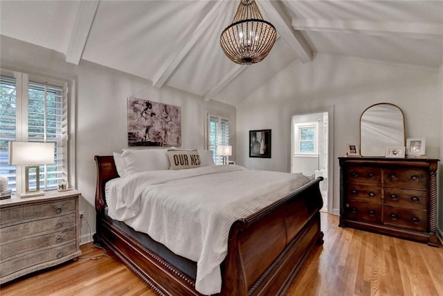 5475 Trowbridge Dr, Dunwoody, GA 30338 - bedroom with a chandelier, baseboards, vaulted ceiling with beams, and light wood-style flooring