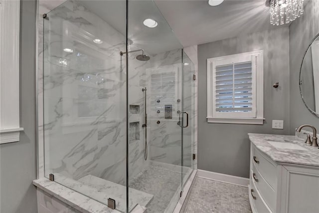 5475 Trowbridge Dr, Dunwoody, GA 30338 - full bath with a marble finish shower, vanity, and baseboards