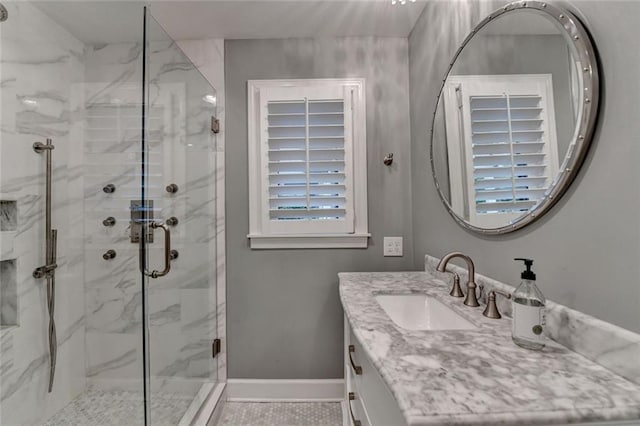 5475 Trowbridge Dr, Dunwoody, GA 30338 - bathroom with tile patterned floors, vanity, baseboards, and a marble finish shower