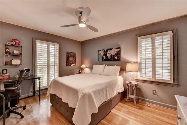 5475 Trowbridge Dr, Dunwoody, GA 30338 - bedroom with baseboards, ceiling fan, and light wood-style floors
