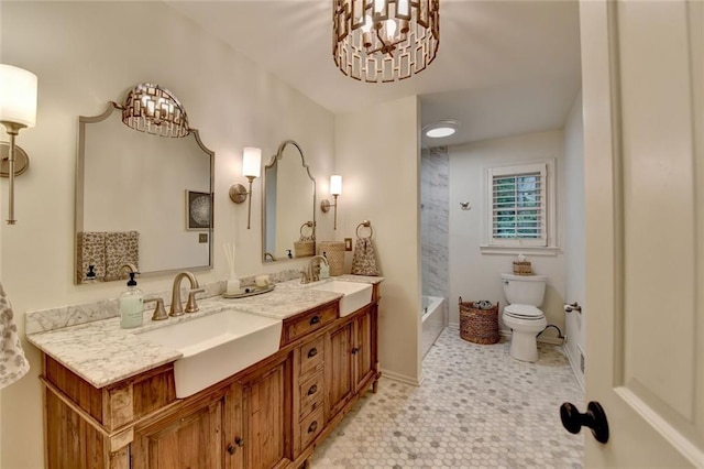 5475 Trowbridge Dr, Dunwoody, GA 30338 - full bath featuring toilet, an inviting chandelier, a sink, and double vanity