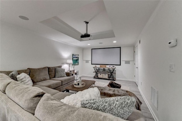 5475 Trowbridge Dr, Dunwoody, GA 30338 - home theater room featuring recessed lighting, a tray ceiling, visible vents, baseboards, and wood finished floors