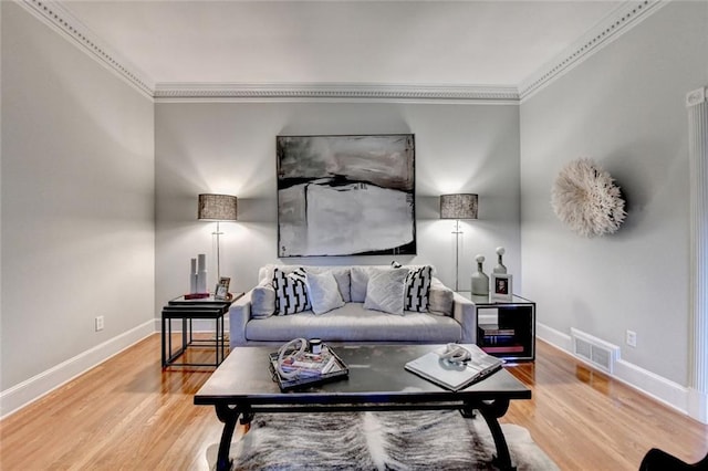 5475 Trowbridge Dr, Dunwoody, GA 30338 - living area featuring wood finished floors, visible vents, crown molding, and baseboards