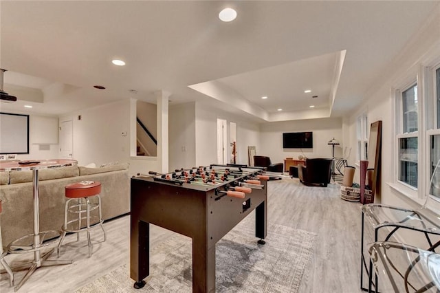 5475 Trowbridge Dr, Dunwoody, GA 30338 - recreation room with a raised ceiling, recessed lighting, and light wood-style flooring