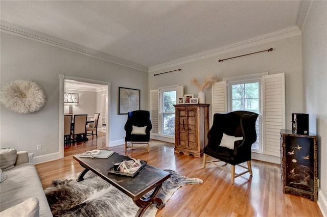 5475 Trowbridge Dr, Dunwoody, GA 30338 - living area with a healthy amount of sunlight, crown molding, light wood finished floors, and baseboards