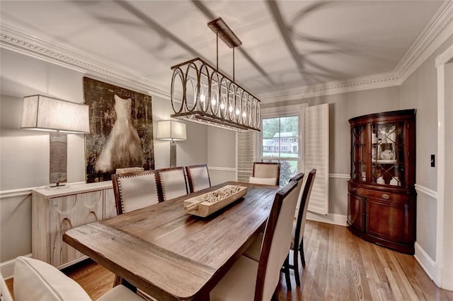 5475 Trowbridge Dr, Dunwoody, GA 30338 - dining room featuring crown molding, wood finished floors, and baseboards