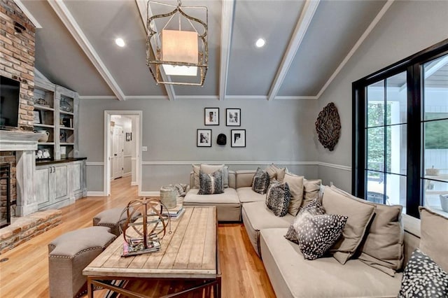 5475 Trowbridge Dr, Dunwoody, GA 30338 - living area with recessed lighting, vaulted ceiling with beams, light wood-style flooring, and a brick fireplace