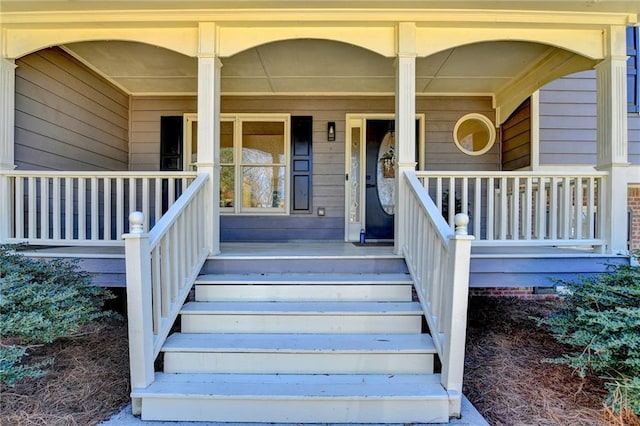 property entrance featuring covered porch