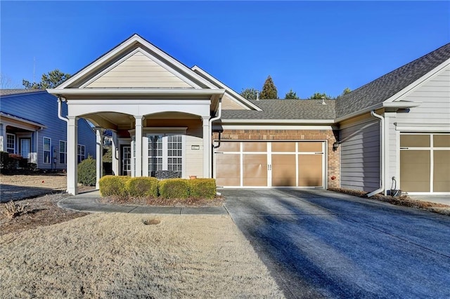 view of front of home with a garage