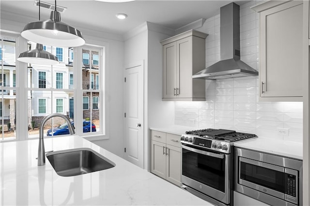 3167 Moor View Rd Unit 35, Duluth, GA 30096 - kitchen featuring visible vents, wall chimney range hood, a sink, a wealth of natural light, and stainless steel appliances