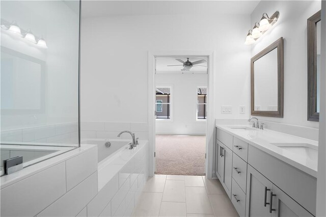 3167 Moor View Rd Unit 35, Duluth, GA 30096 - full bath featuring double vanity, ceiling fan, a bath, tile patterned floors, and a sink