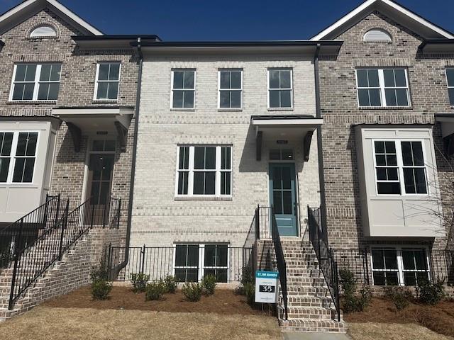 3167 Moor View Rd Unit 35, Duluth, GA 30096 - view of front of house featuring brick siding and stairway