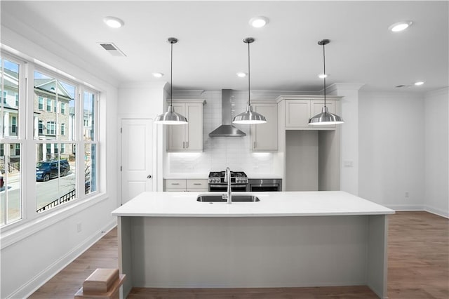 3167 Moor View Rd Unit 35, Duluth, GA 30096 - kitchen featuring visible vents, a sink, wall chimney exhaust hood, and light countertops