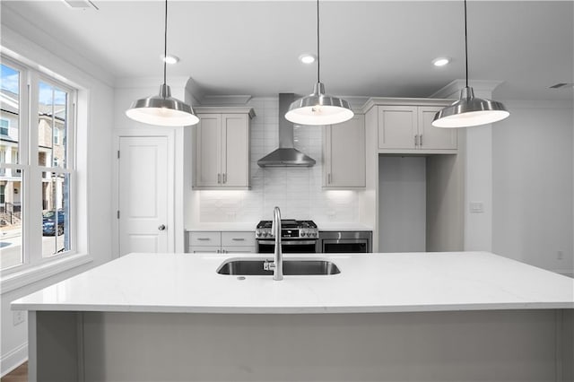 3167 Moor View Rd Unit 35, Duluth, GA 30096 - kitchen featuring a center island with sink, wall chimney exhaust hood, gray cabinets, tasteful backsplash, and stainless steel range with gas stovetop