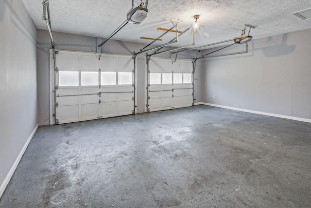 garage featuring baseboards and a garage door opener