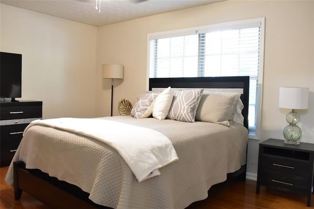 1676 Northridge Dr, Morrow, GA 30260 - bedroom featuring baseboards, wood finished floors, and multiple windows
