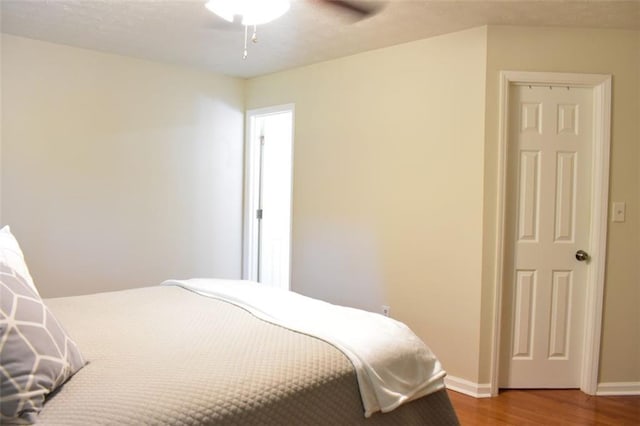 1676 Northridge Dr, Morrow, GA 30260 - bedroom with baseboards, ceiling fan, and wood finished floors