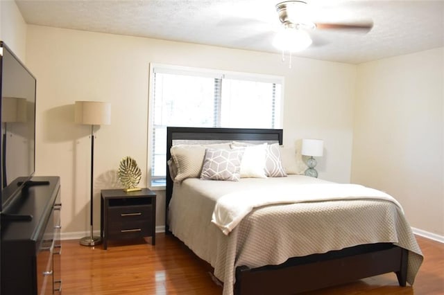 1676 Northridge Dr, Morrow, GA 30260 - bedroom with baseboards, a ceiling fan, and wood finished floors