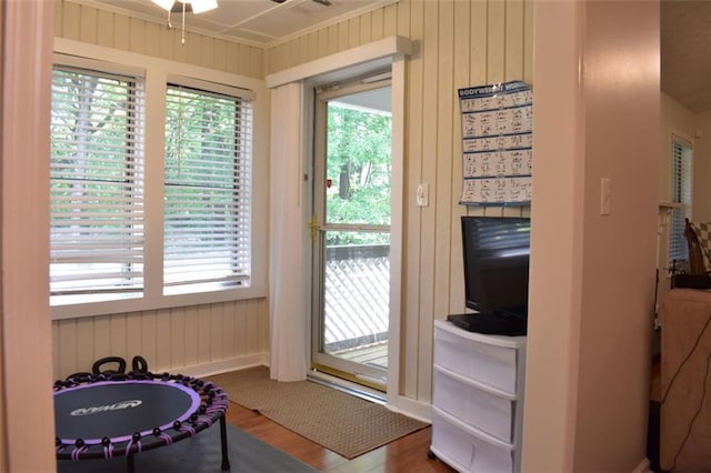 1676 Northridge Dr, Morrow, GA 30260 - doorway with a ceiling fan, wood finished floors, and wood walls