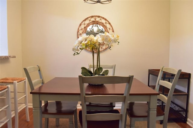 1676 Northridge Dr, Morrow, GA 30260 - dining room featuring an inviting chandelier, baseboards, and wood finished floors