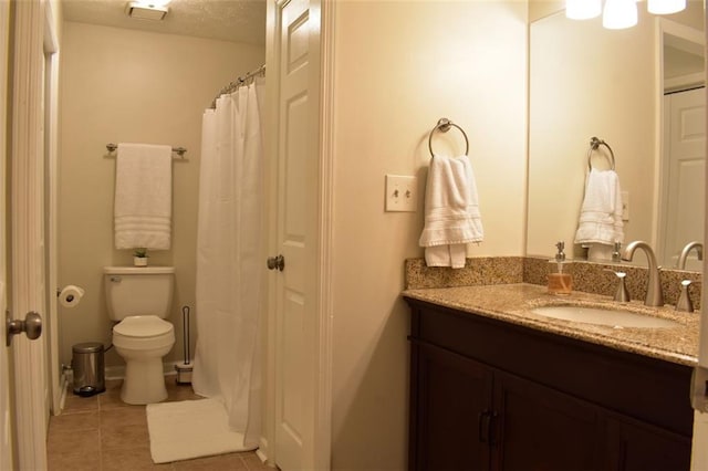 1676 Northridge Dr, Morrow, GA 30260 - bathroom with tile patterned flooring, a textured ceiling, toilet, and vanity
