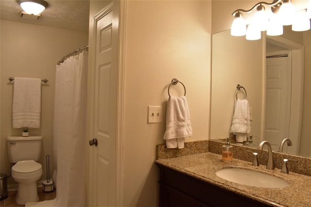 1676 Northridge Dr, Morrow, GA 30260 - bathroom featuring vanity, a textured ceiling, and toilet