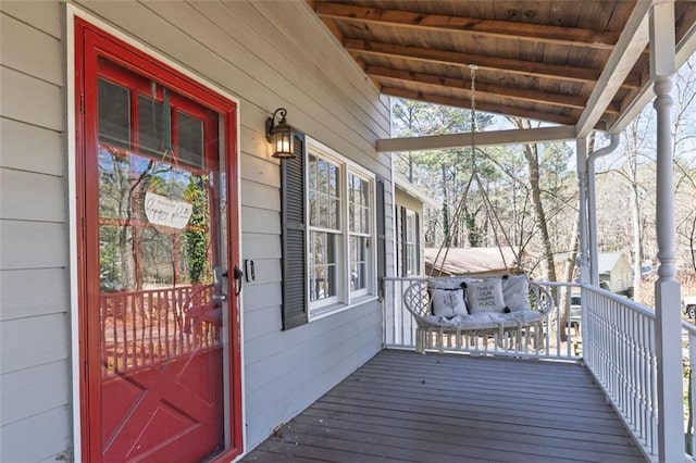 wooden terrace with a porch