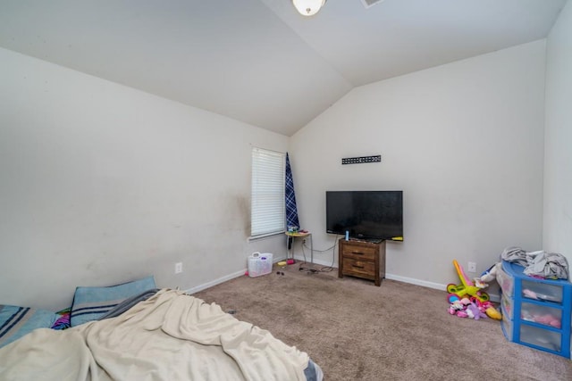 carpeted bedroom with lofted ceiling