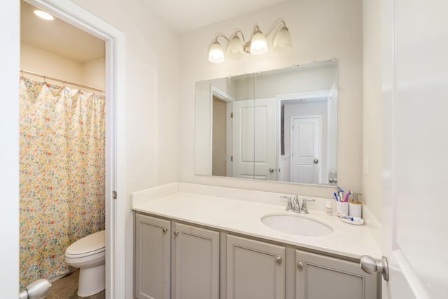 bathroom featuring a shower with curtain, tile patterned flooring, vanity, and toilet